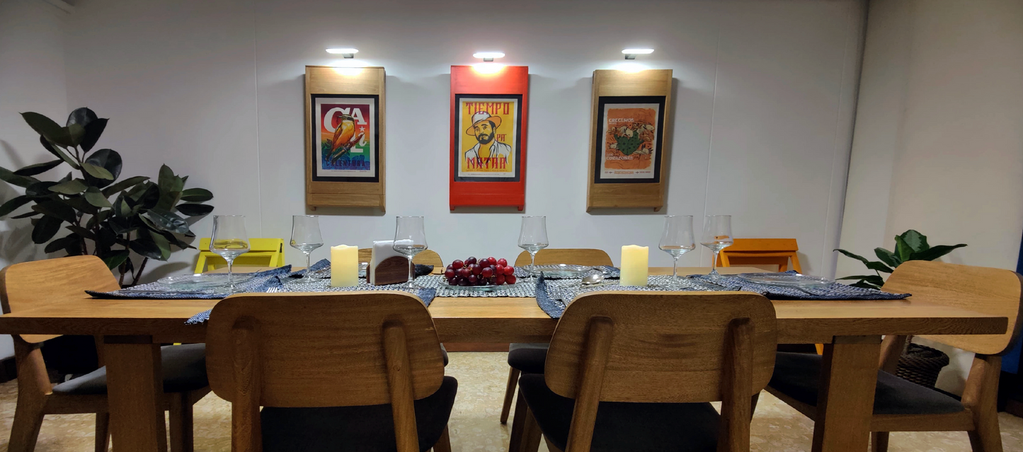 dining room with 3 extra PicChairs on wall and 2 on floor