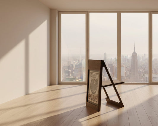 The PicChair in dark oak; Poster with a graphic illustration of a bird.