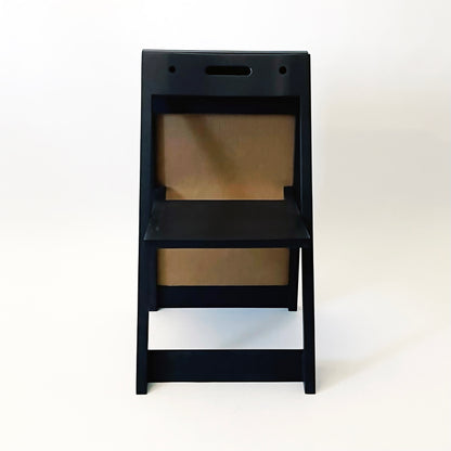 The PicChair in Black ,opened up as a chair. Two holes and handle are showing.