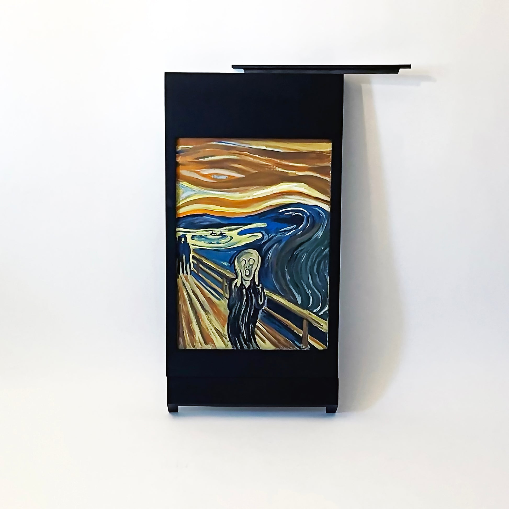 The Black PicChair leaning against the wall with the picture slot cover removed