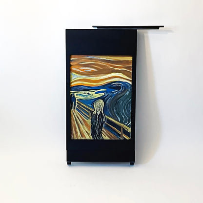 The Black PicChair leaning against the wall with the picture slot cover removed