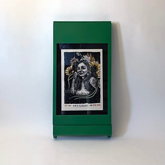 PicChair in green; view of chair folded up as a frame with art on the wall.