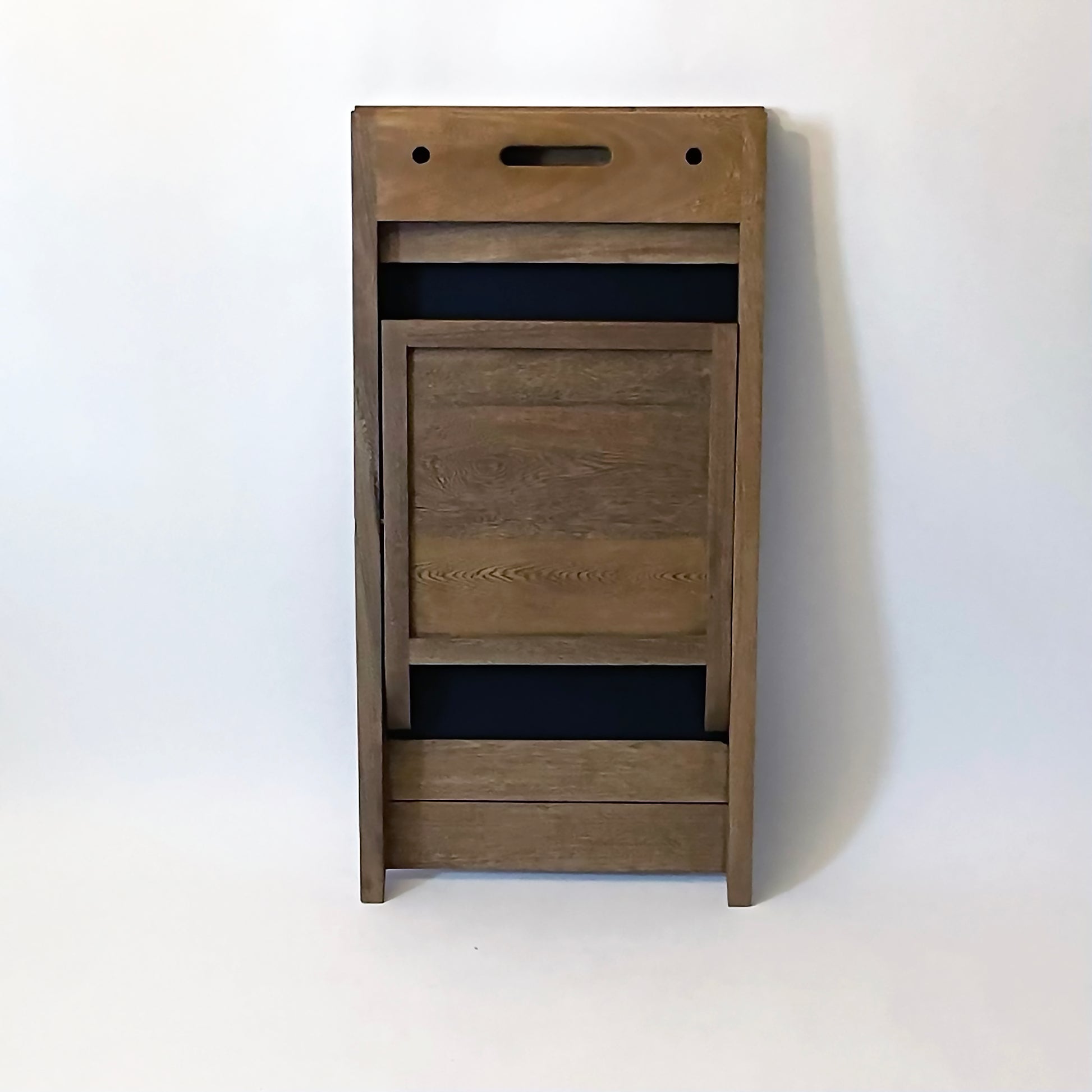 PicChair in dark oak; view of chair folded up as a frame.