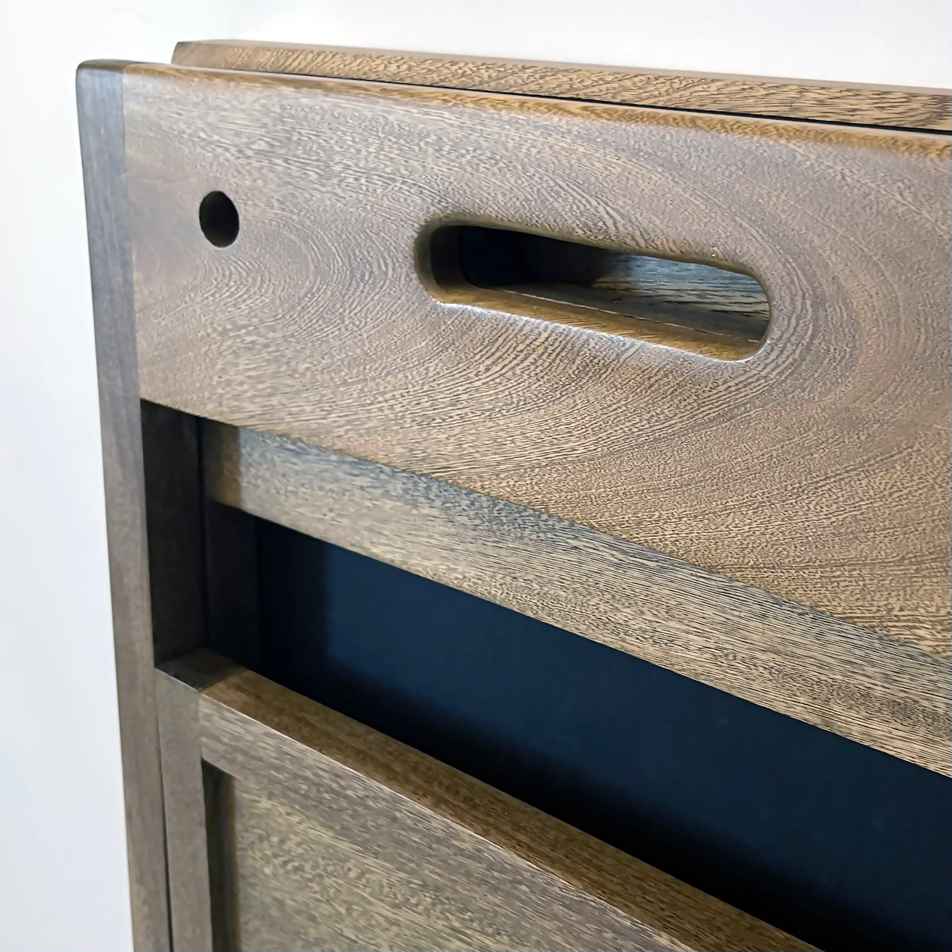 PicChair in dark oak; close up view of chair folded up as a frame.