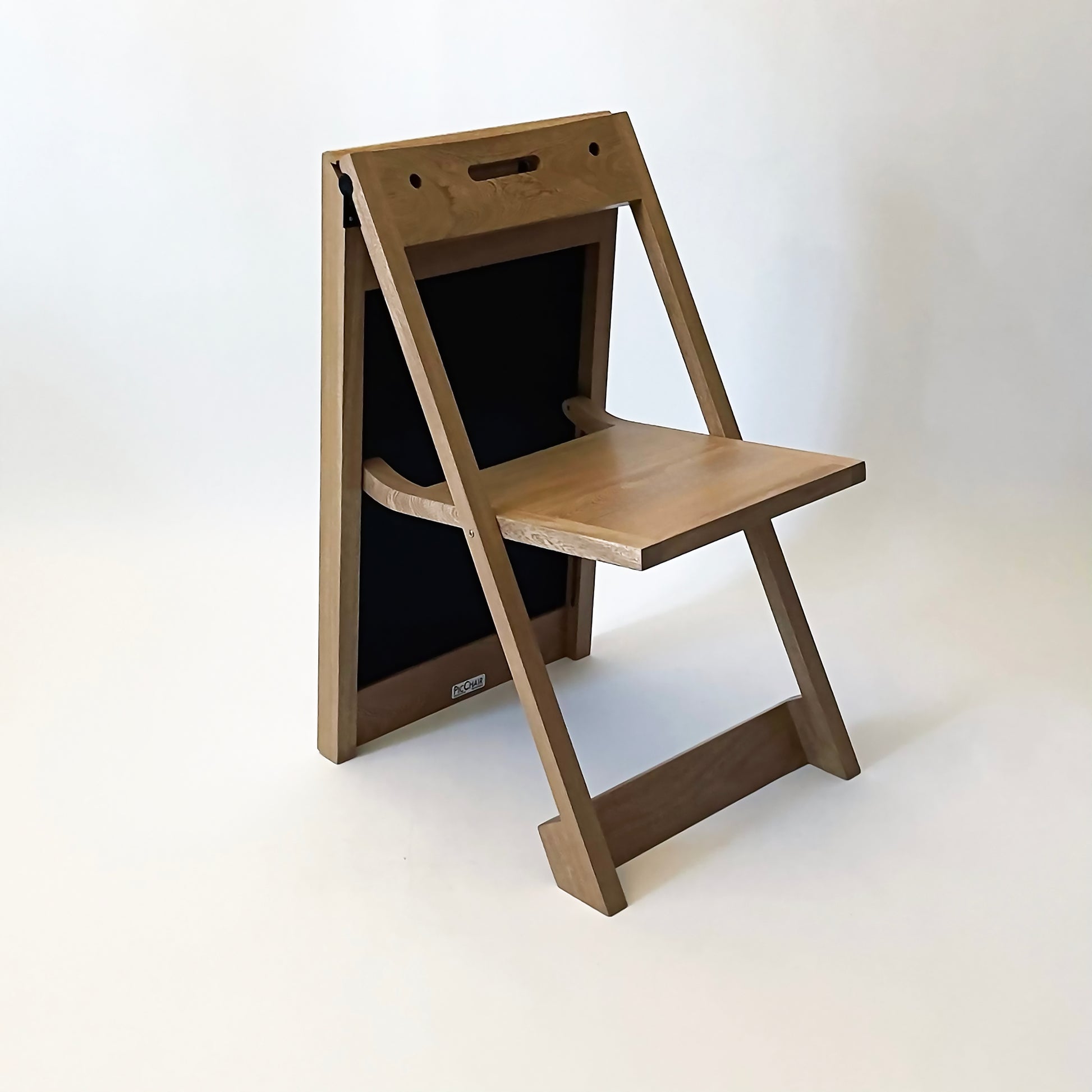 PicChair in natural oak; side view of chair.