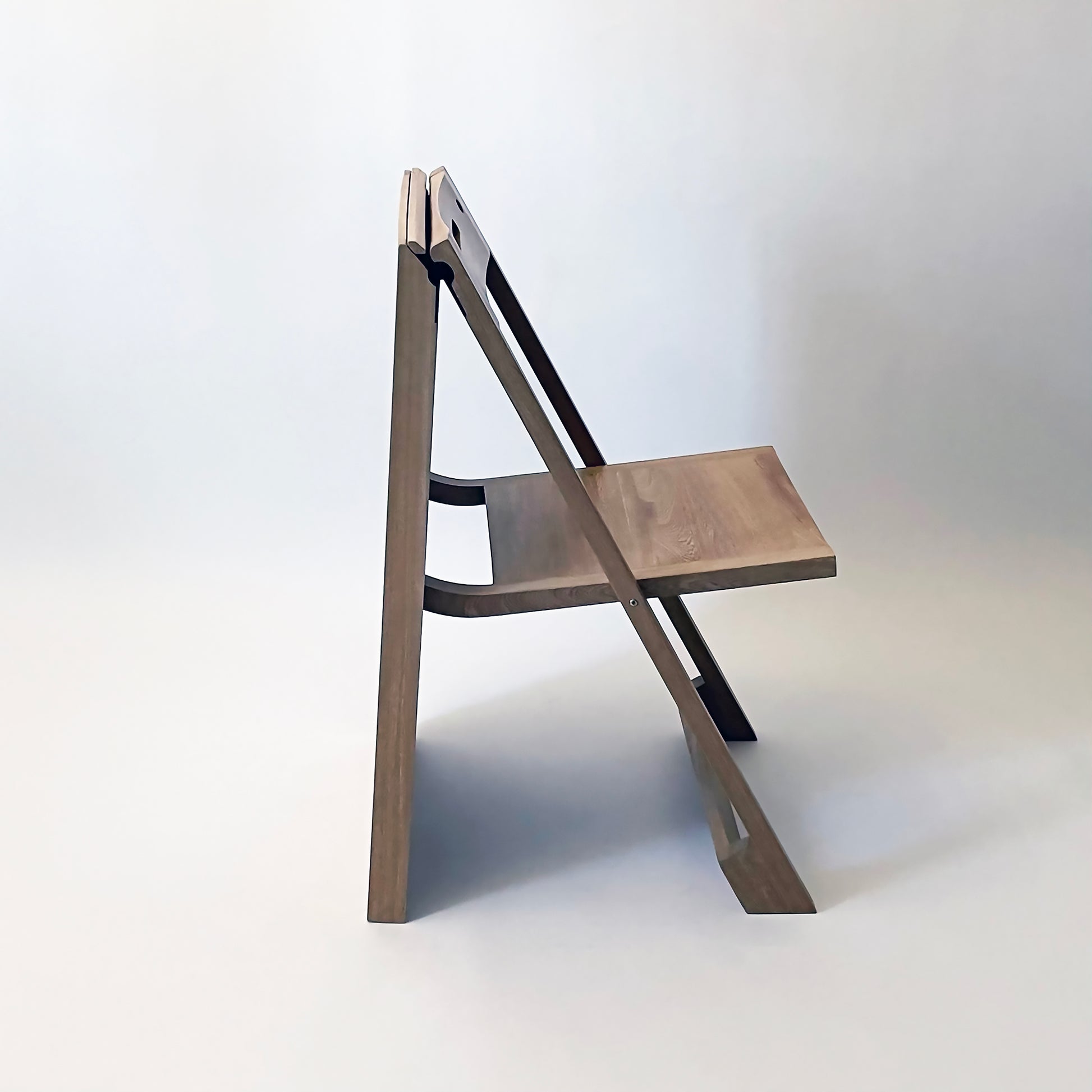 PicChair in natural oak; side view of chair while open.