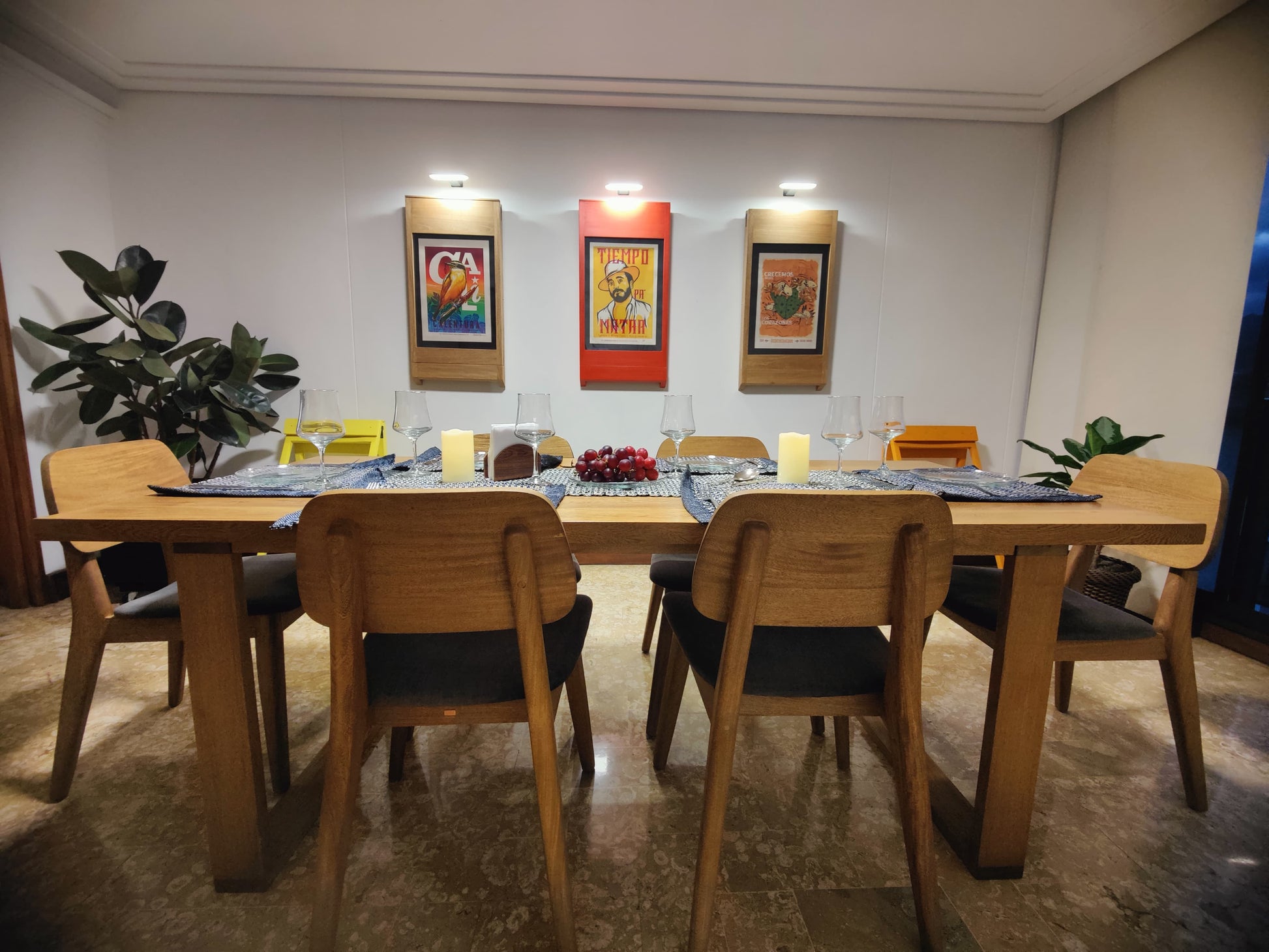 Dining room with 3 extra. PicChairs on walls  and 2 PicChairs on open
